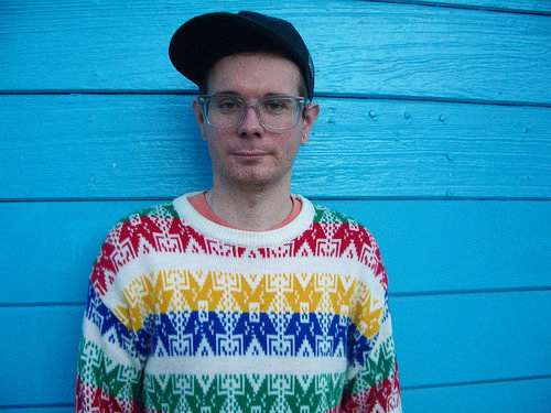 Photo of Eric A. Stanely wearing baseball cap and ugly sweater