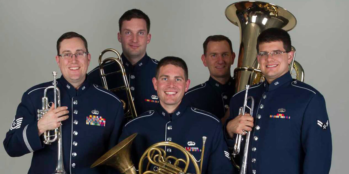 Photo of the Air Force Band of the Golden West Brass Quintet in uniform and holding their instruments