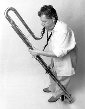 Black and white photo of Paul Austerlitz playing the contra bass clarinet