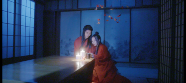 Photo of two young women lighting candles