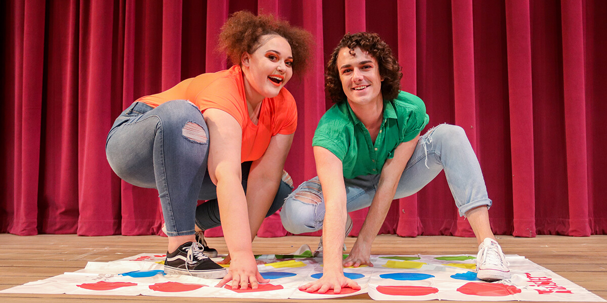Photo of woman and man playing Twister