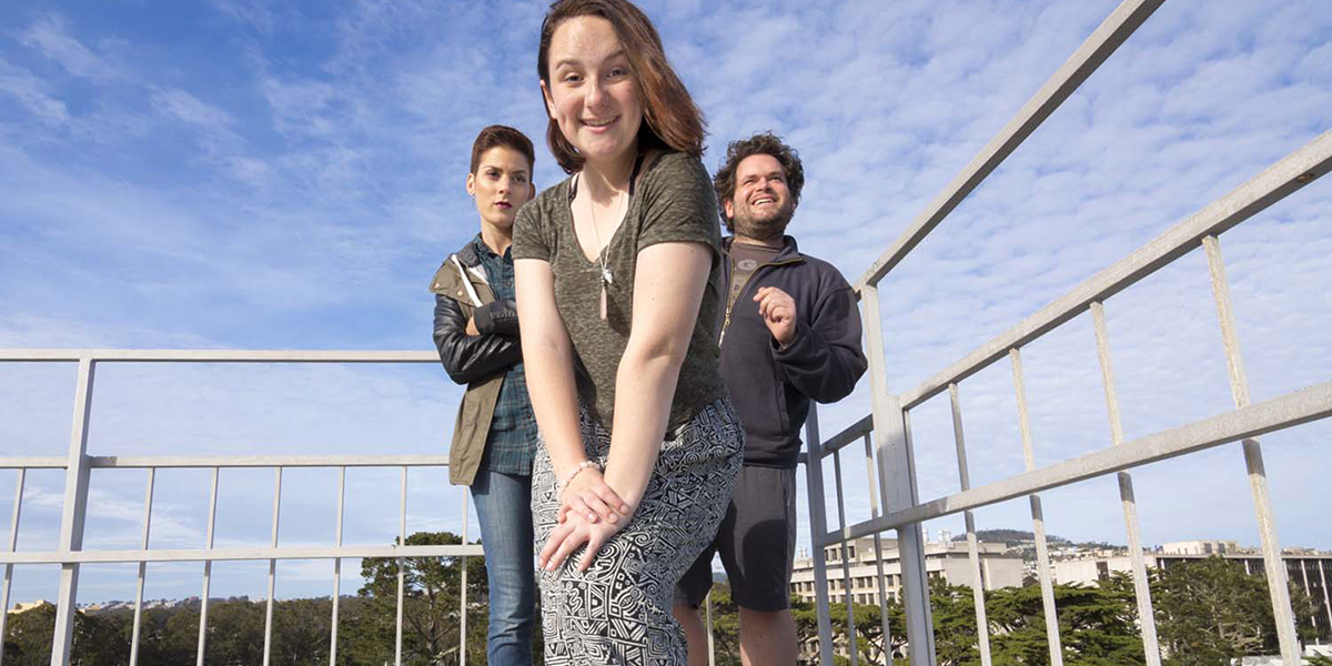 Photo of three students on roof deck of Cesar Chavez Student Center