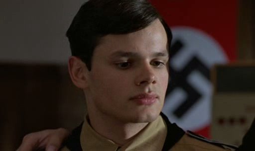 Still of man in front of Nazi flag from Europa, Europa
