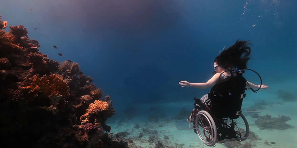Photo of woman in wheelchair underwater
