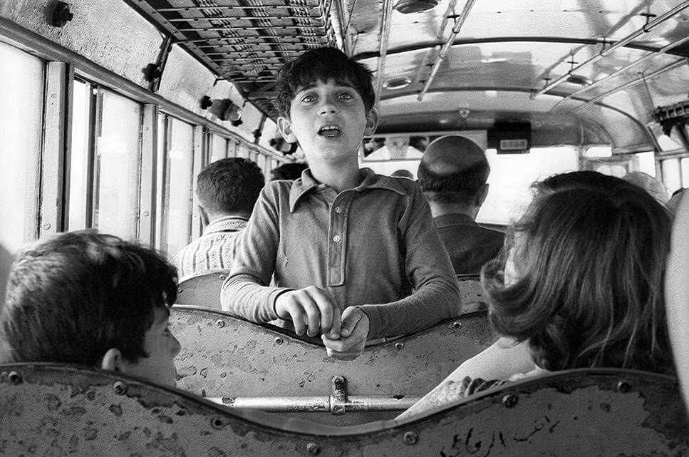 Black and white photo from 1979 of boy on an Arab bus in Jerusalem