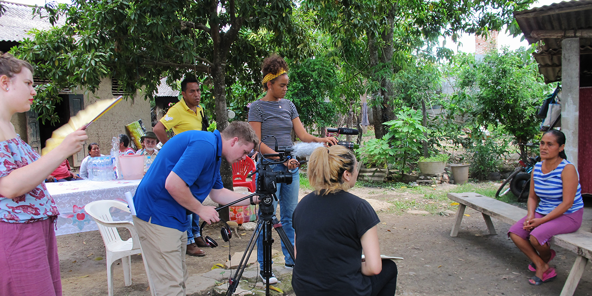 Photo of students filming an interview outdoors in Mexico