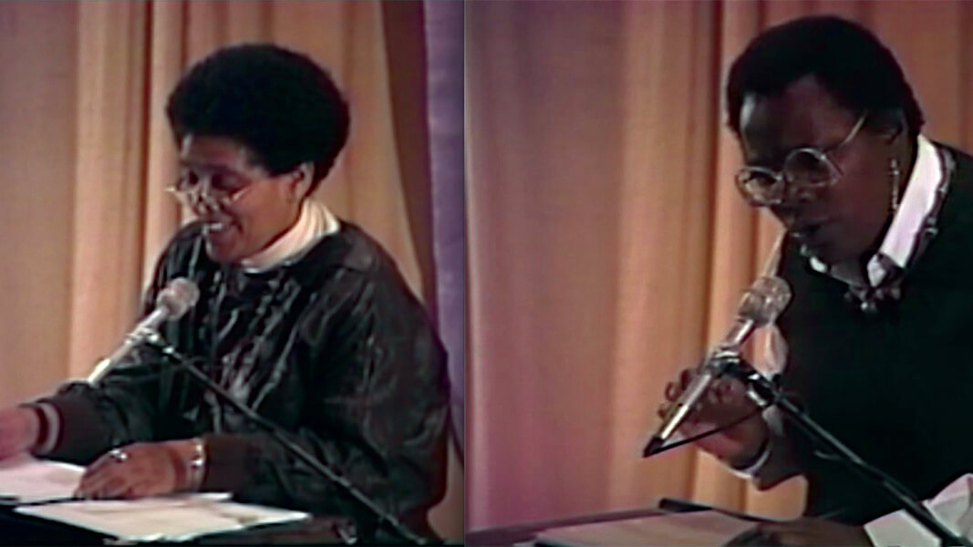 Video still of Audre Lorde and Pat Parker reading their poetry in 1986 in San Francisco