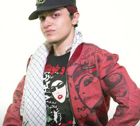 Photo of Hushidar Mortezaie wearing a scarf, baseball cap and jacket
