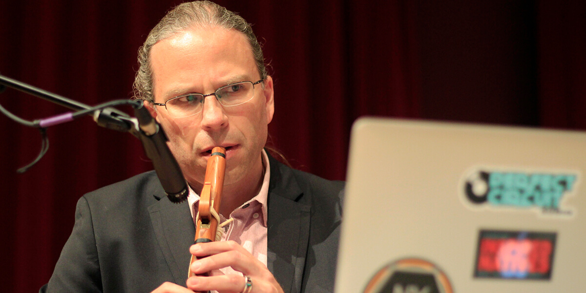 Photo of John-Carlos Perea playing the flute