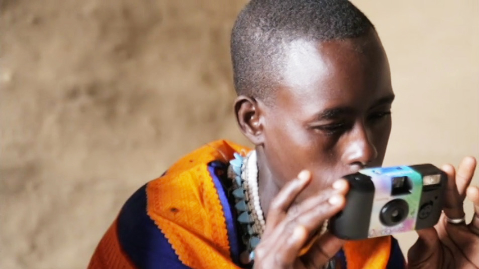 Photo of woman in Tanzania using a camera