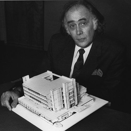 Photo of August Coppola holding Fine Arts Building model