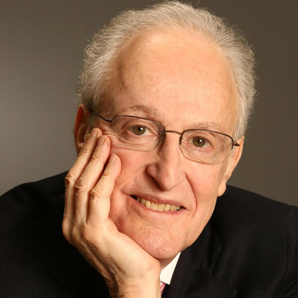 Photo of David Shire resting his chin on his right hand