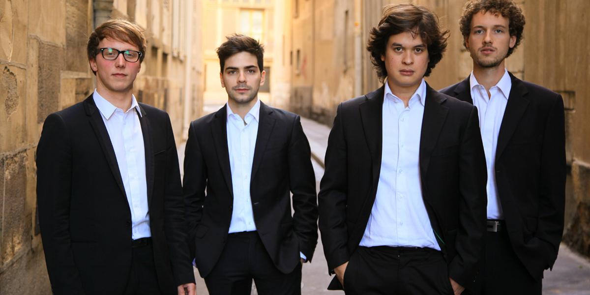 Photo of Van Kuijk Quartet standing in an alley