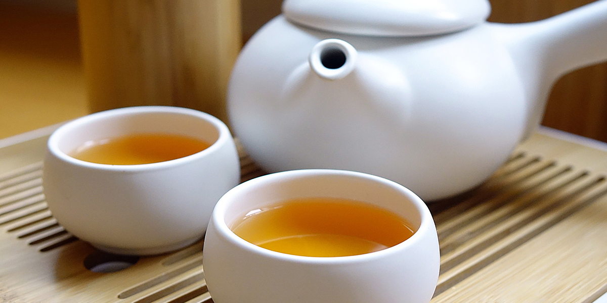 Photo of teapot and two filled teacups