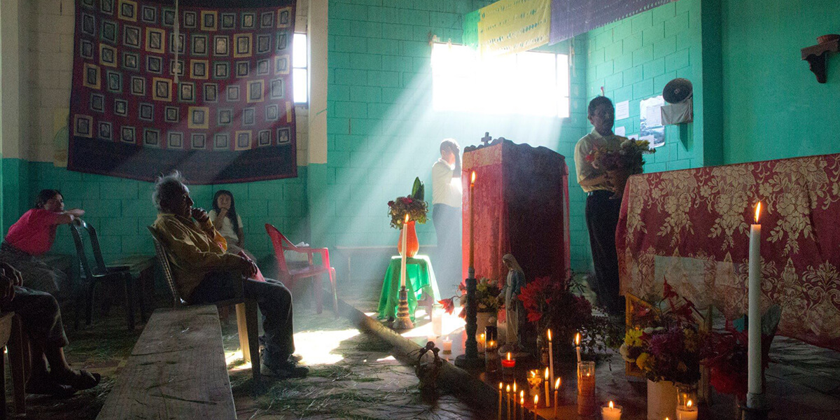 Photo of candlelight vigil in Guatemala from the Earth Did Not Speak documentary