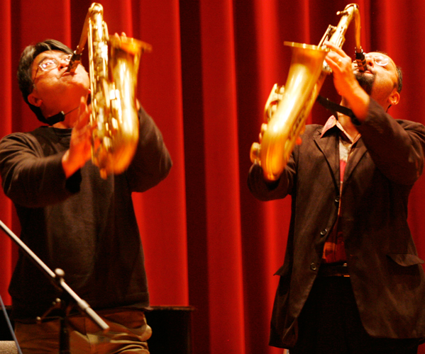 Photo of Francis Wong and Hafez Modirzadeh playing their saxophones