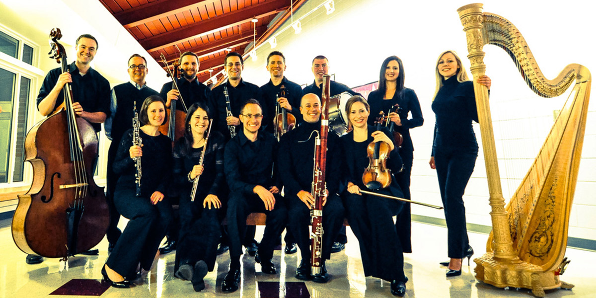 Photo of the Inscape Ensemble holding instruments