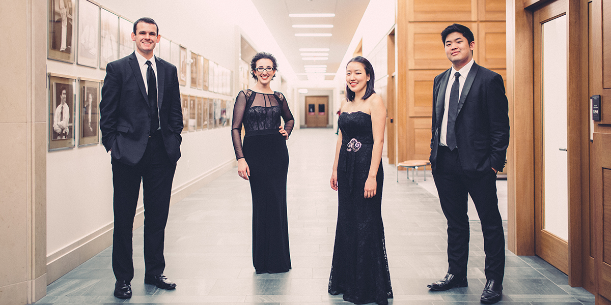 Photo of the Verona Quartet standing in a hallway