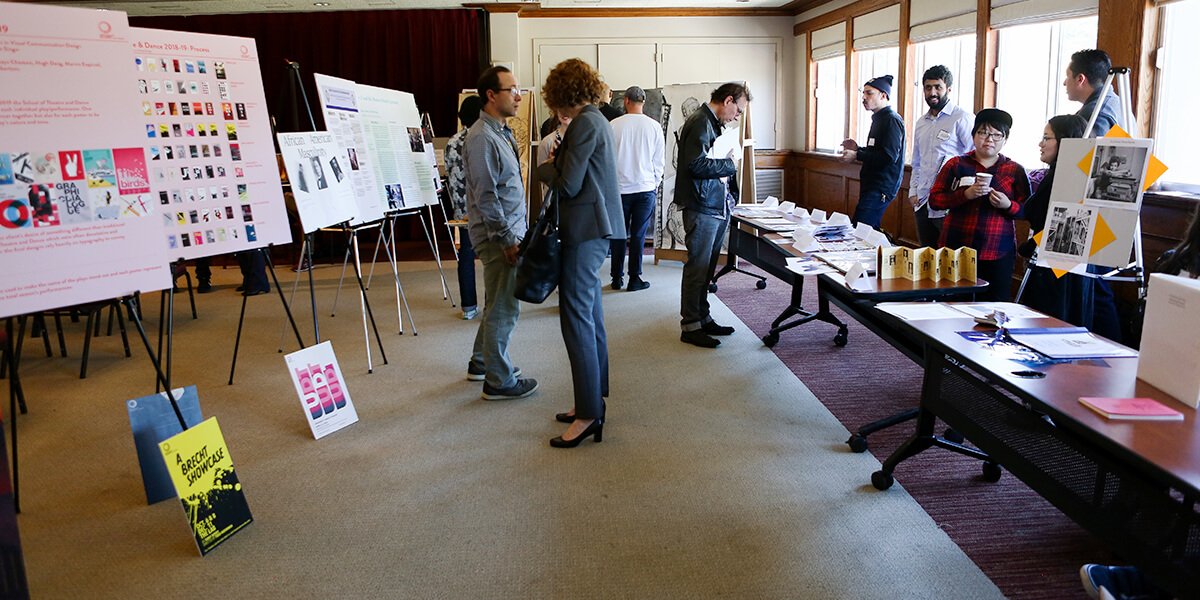 Photo of people viewing presentations at 2018 Undergraduate Research Showcase