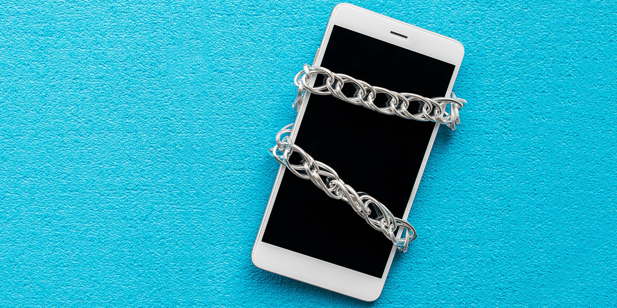 Image of cell phone wrapped in a chain link