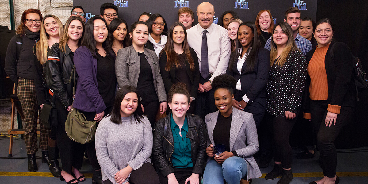 Group photo of Dr. Phil McGraw and interns