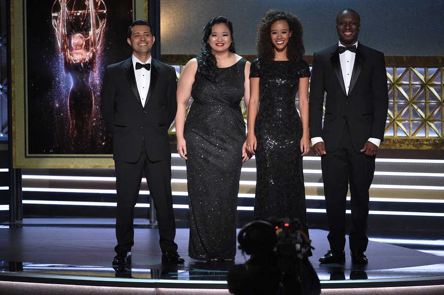 Photo of four Television Academy interns on stage at Emmy Awards