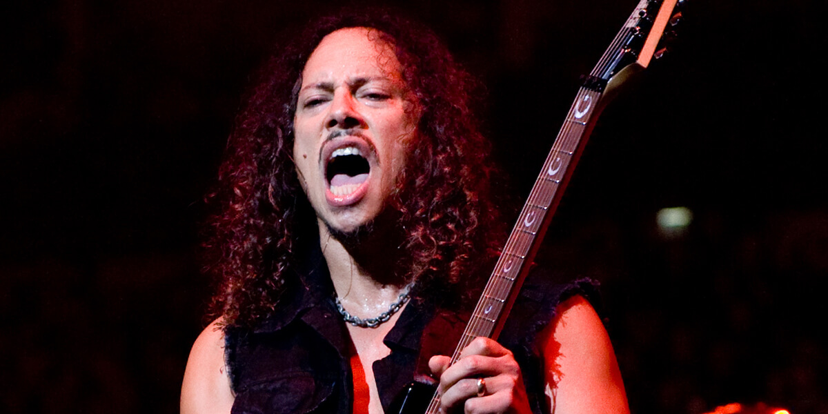 Photo of Kirk Hammett playing electric guitar