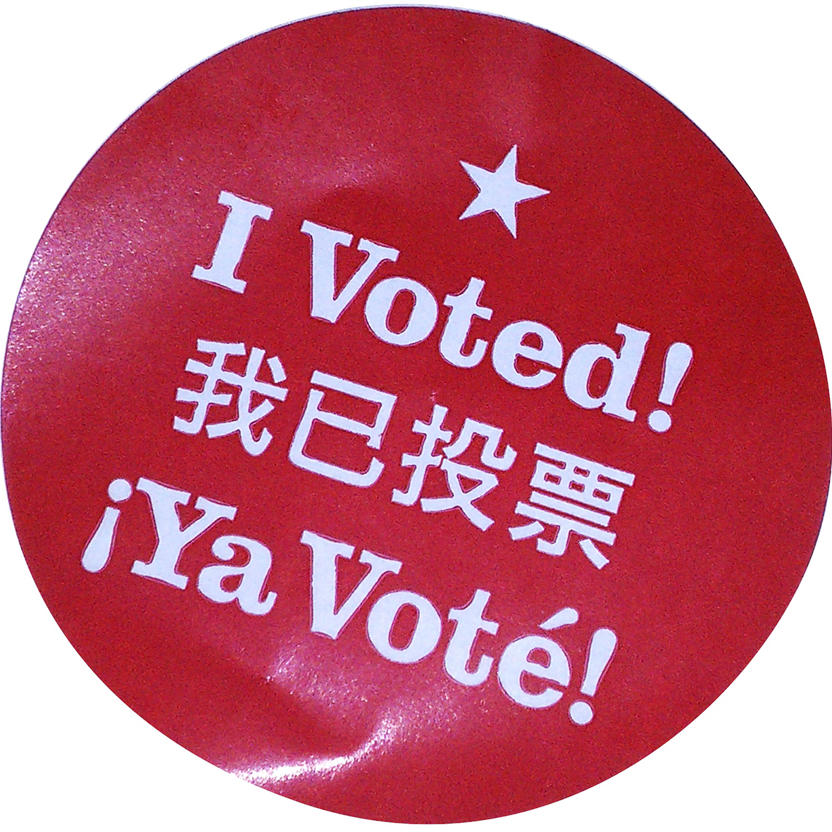 Photo of I Voted sticker in English, Chinese and Spanish
