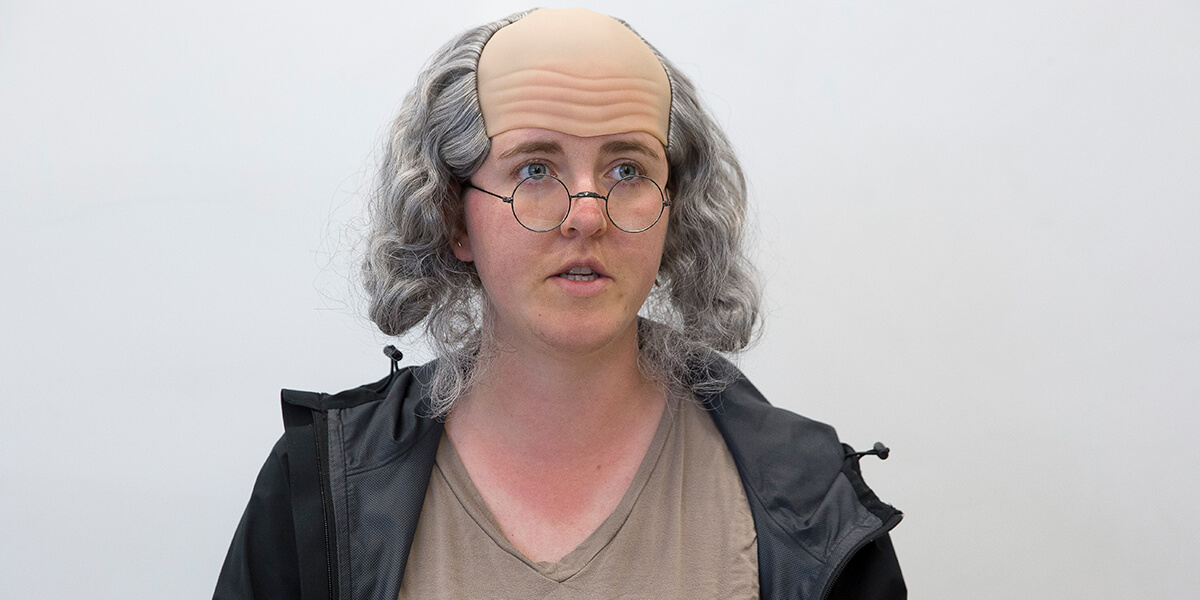 Photo of Serafina Kernberger wearing Benjamin Franklin wig and glasses