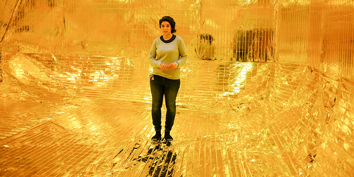 Photo of Shirin Khalatbari standing inside her installation