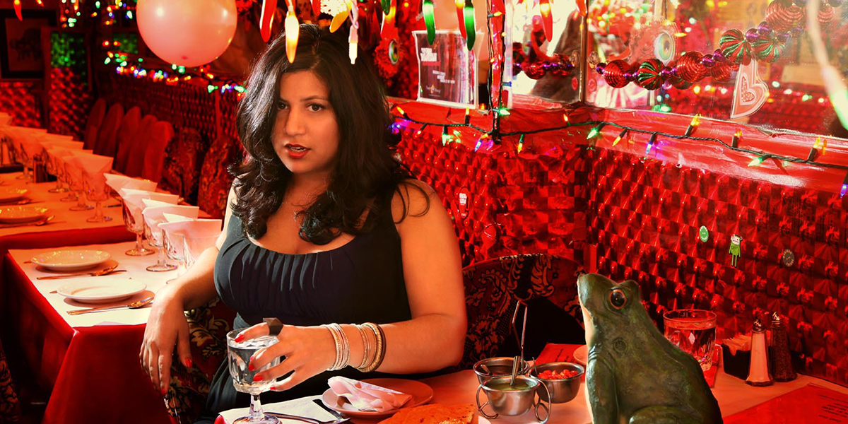 Photo of Samhita Mukhopadhyay seated in a restaurant