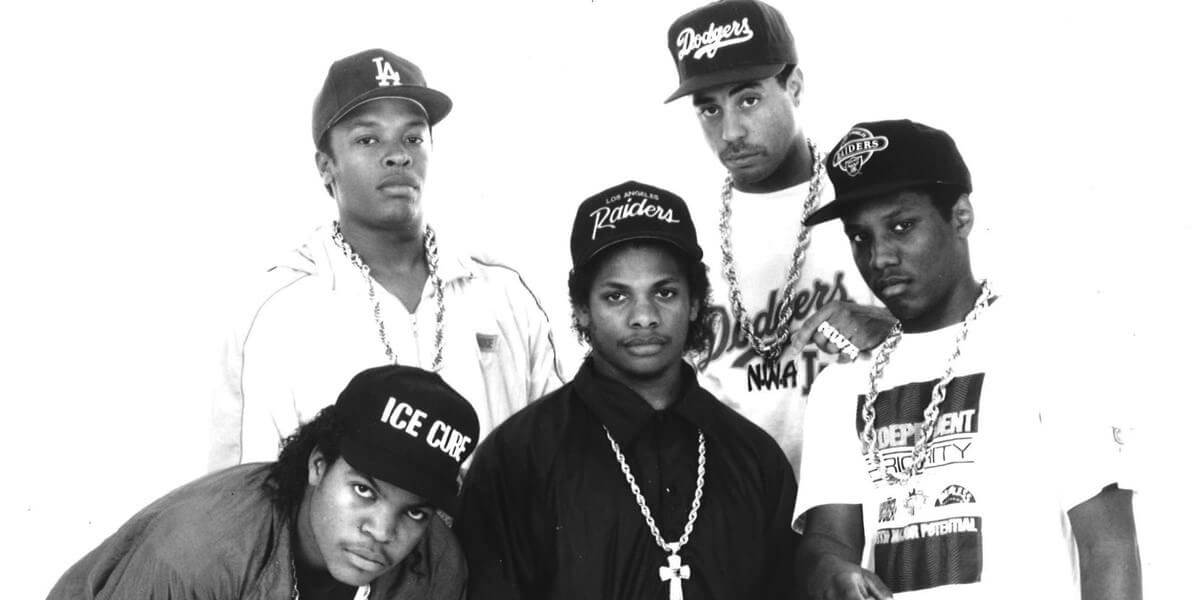Black and white photo of five members of rap group NWA