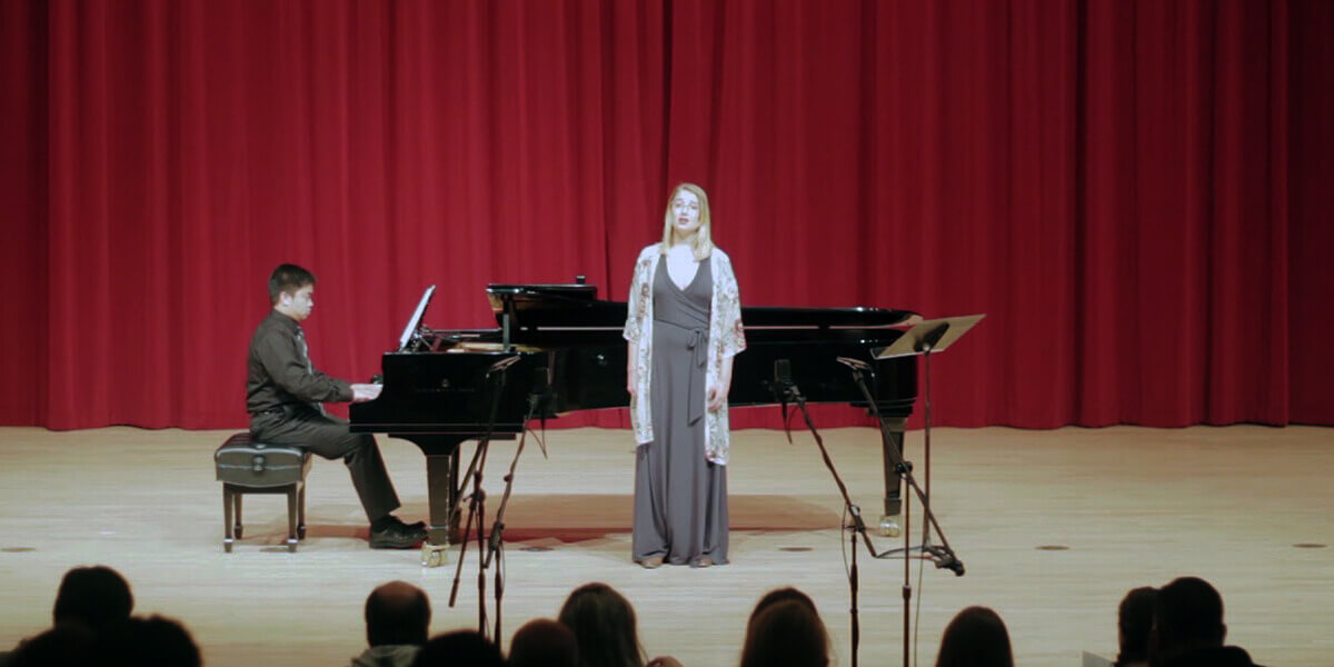 Photo of pianist Kyle Pescasio and soprano Emily Crawford performing in Knuth Hall
