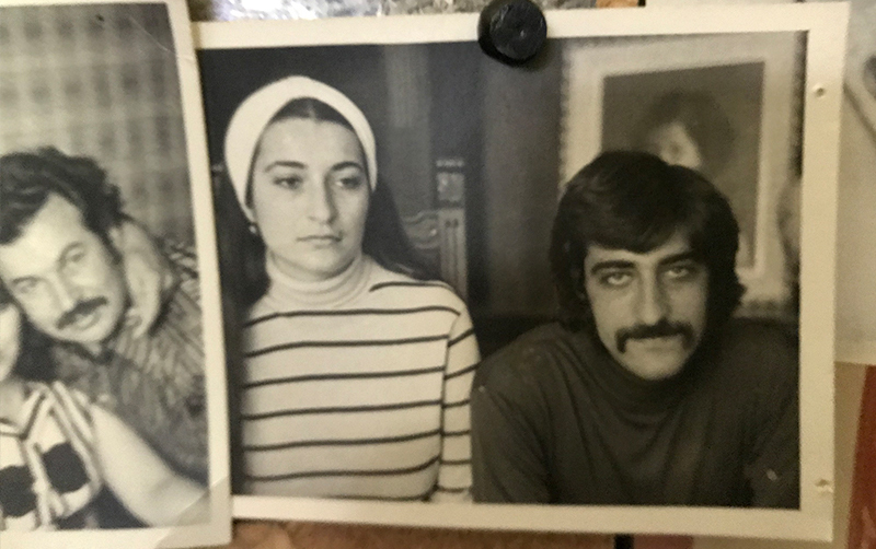 Two black and white photos on bulletin board of Bella and Bendad Warda from 1970s