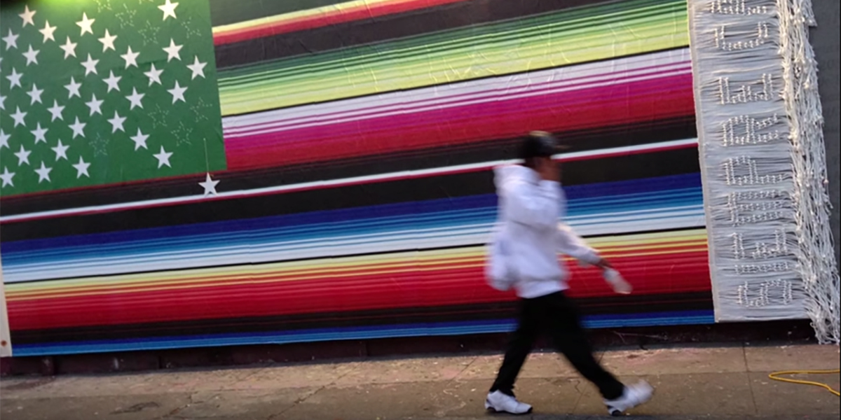 Photo of a public installation of Victor De La Rosa's Future Flags of America textile piece