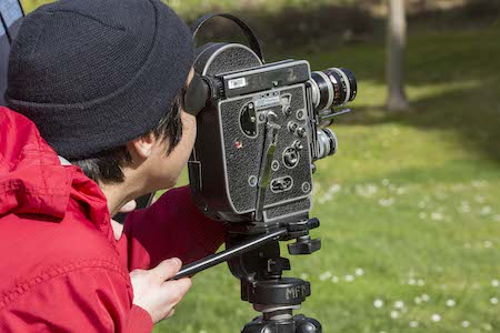 Cinema student operatiing Bolex 16 mm movie camera