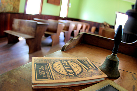 Book cover in foreground, empty pews in background