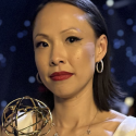 Poh Si Teng holds her Emmy Award statuette while standing at the awards ceremony