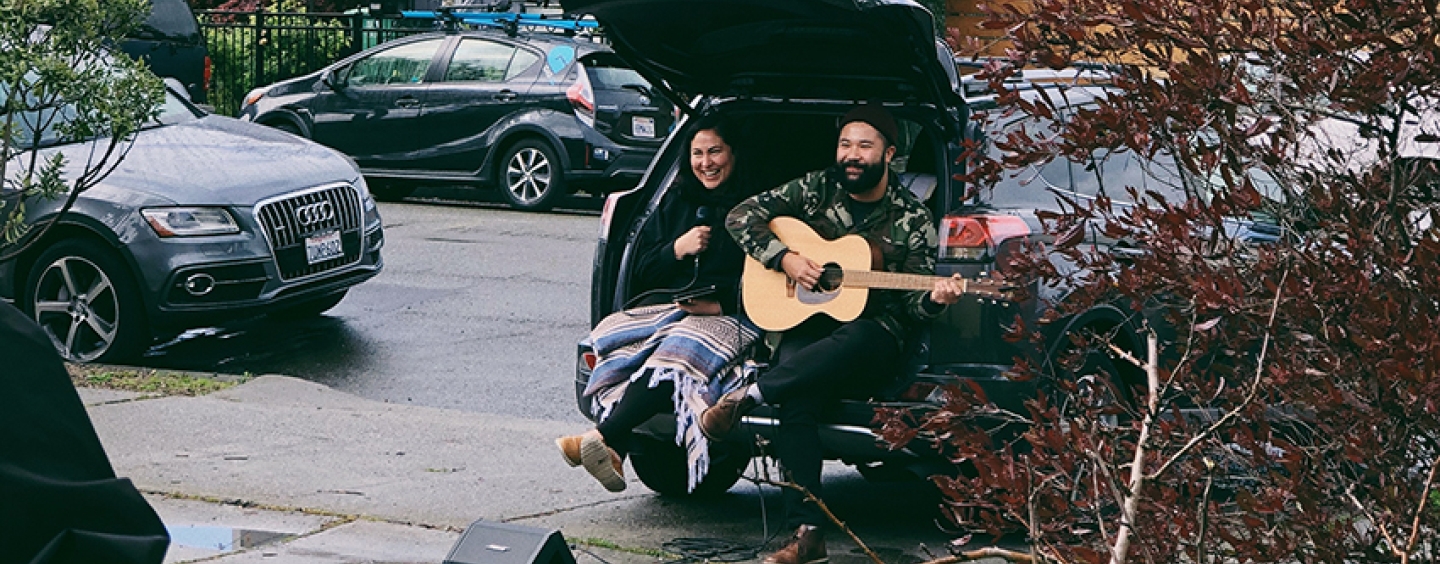 Alumni Rachel Garcia and Thu Tran performing a concert from their car