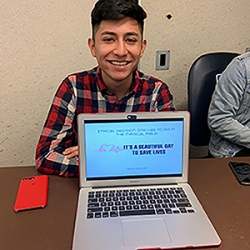 Student presenting with laptop