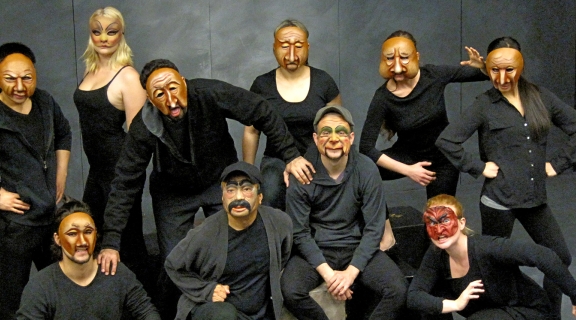Dance troupe wearing masks
