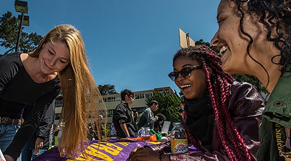 sfsu students outside at table